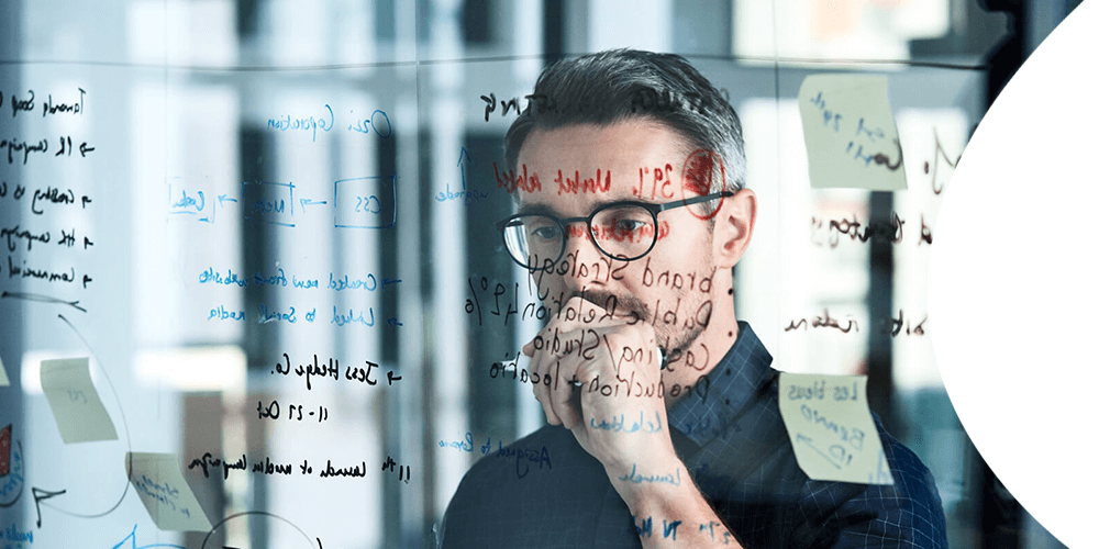 businessman-glass-wall_copyright-Dean-Mitchell_iStock-1133782934